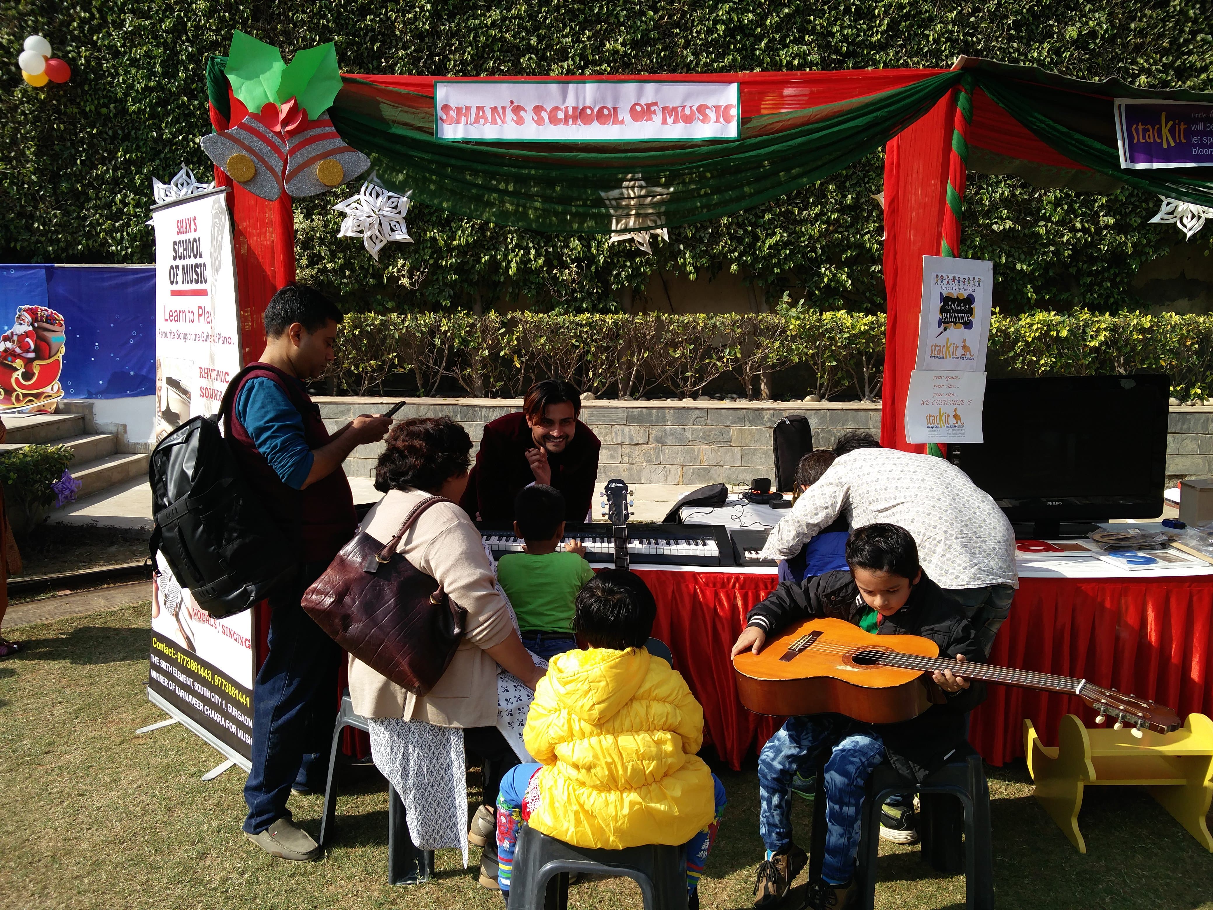 Guitar Keyboard and Piano lessons for beginners at Christmas carnival Vasant Kunj and Gurgaon